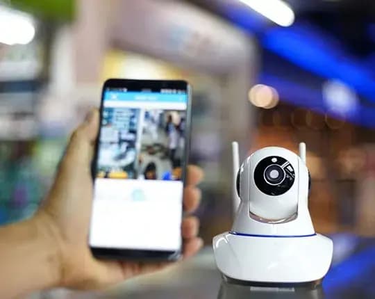 Monitored home security camera feed reviewed on a smartphone